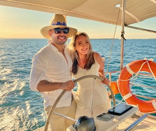 Couple on a sunset sail on a private yacht charter on Curlew Escape, Moreton Bay, Brisbane.