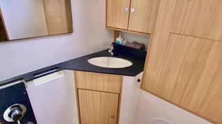 Bathroom ensuite, rear cabin on  on  Sailing Yacht Curlew Escape, available for private yacht charters on Moreton Bay, Brisbane.