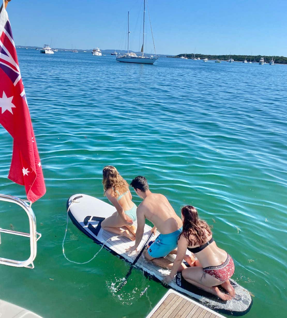 SUP at Horseshoe Bay, Peel Island, Moreton Bay, Brisbane while on a private yacht charter aboard Curew Escape
