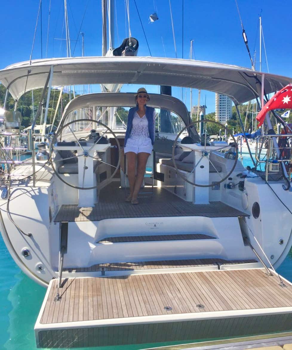 Yacht, available for luxury private yacht charters, Moreton Bay, Brisbane, with stern lowered for access from the dock.