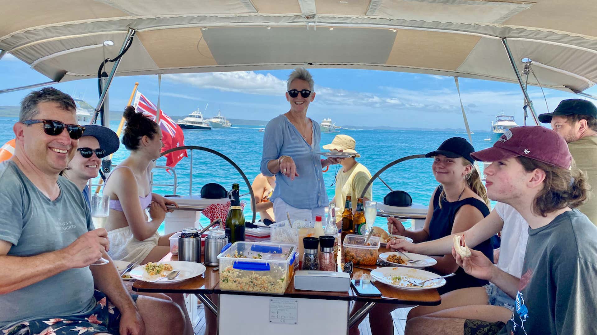 Guests dining aboard sailing yacht Curlew Escape on a private yacht charter in Moreton Bay, Brisbane.
