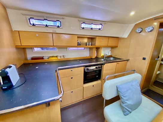 Kitchen showing Coffee Machine, Oven, Sinks and preparation area